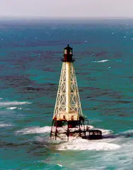 Alligator Reef Light White octagonal pyramid on black skeleton tower.