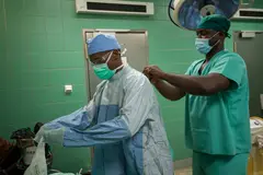 Caps, scrubs, goggles, and face mask