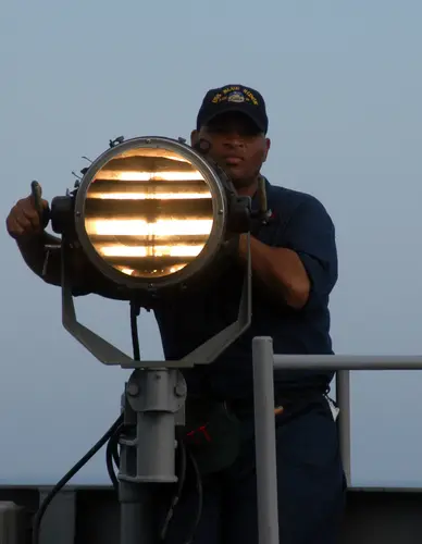 Seaman send Morse code signals